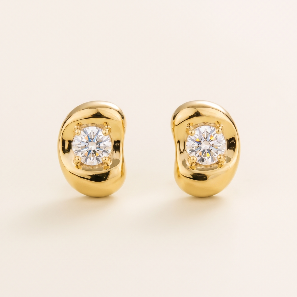 Fava round lab-grown diamond stud earrings in gold, sculpted pebble setting, front view | Juvetti London