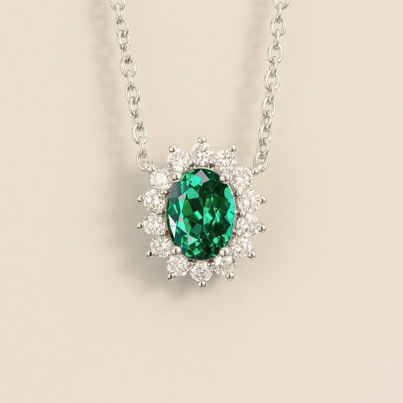 A necklace from Juvetti called Divo, with emerald and diamonds set in white gold.