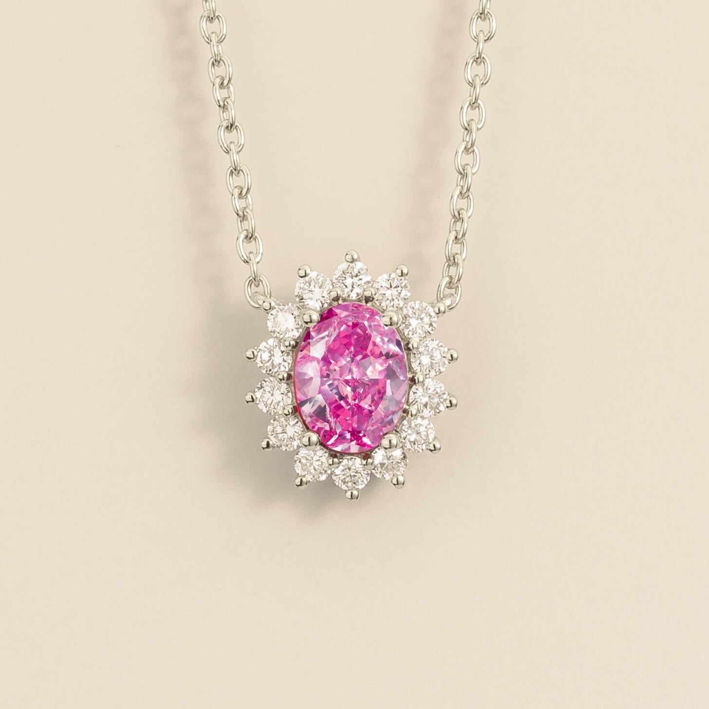 White gold necklace from Juvetti called divo set in pink sapphire and diamonds.