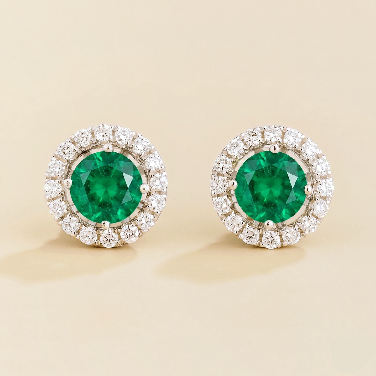 Floret round lab-grown emerald and diamond halo stud earrings in white gold – front | Juvetti London