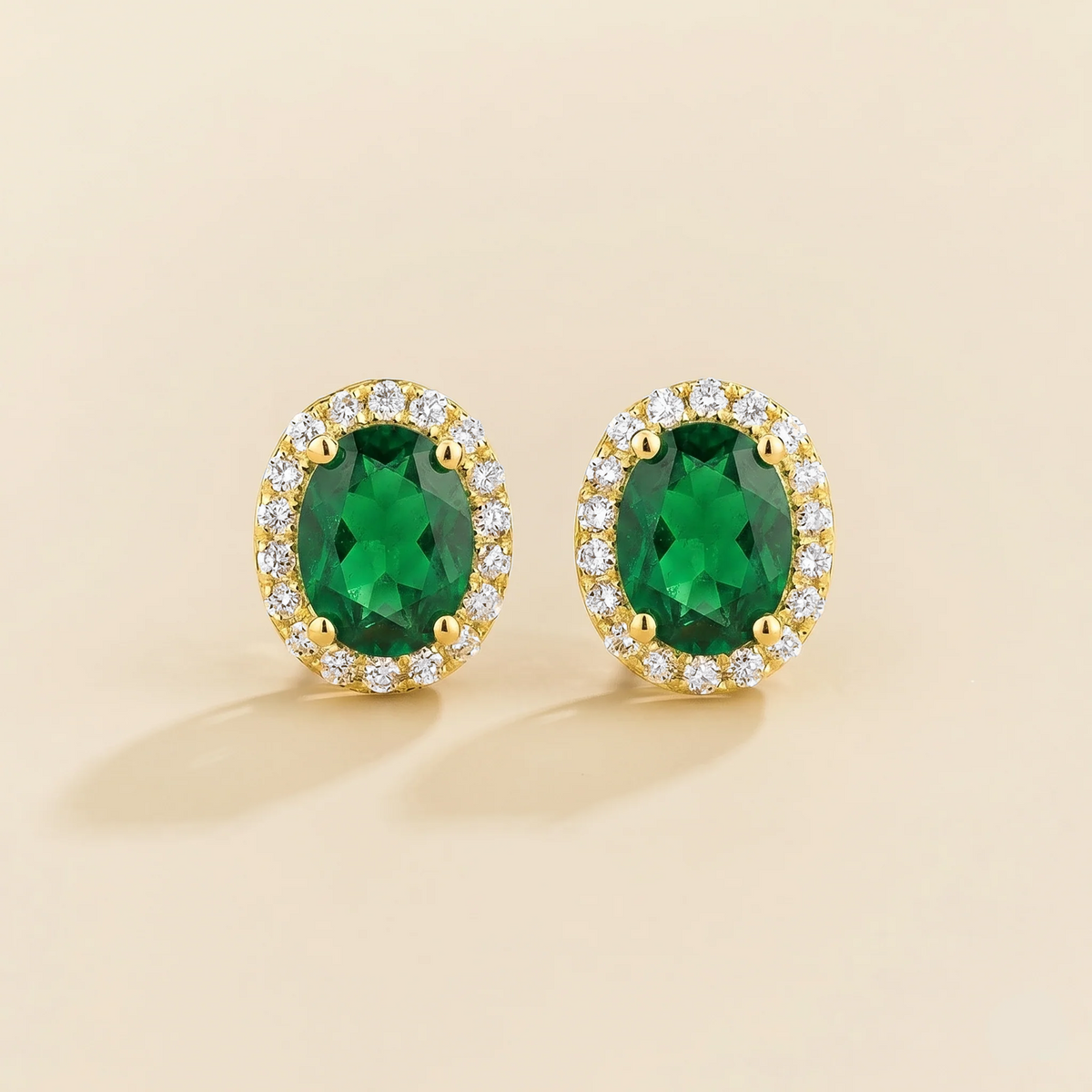 Lab-grown emerald and diamond oval halo stud earrings in gold – front view | Mina by Juvetti