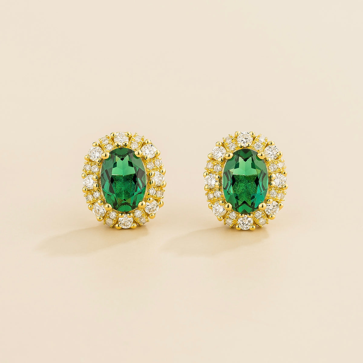 Viva oval lab-grown emerald and diamond halo stud earrings in gold | Juvetti London