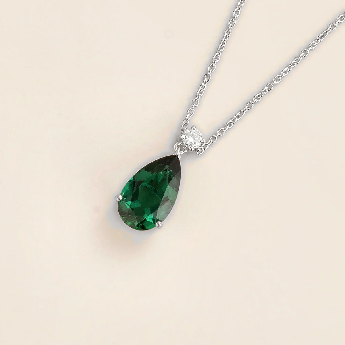 Lab-grown emerald and diamond pear drop pendant necklace in white gold, large – angled view | Pisa by Juvetti