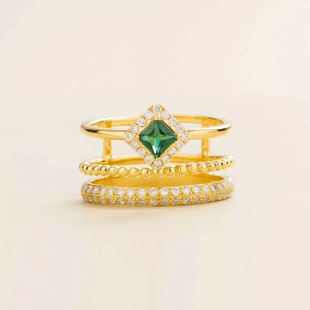 Amici triple-band stacking ring in gold, princess-cut lab-grown emerald in a diamond halo with beaded and pavé bands, front view | Juvetti London