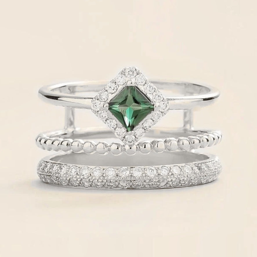 Amici triple-band stacking ring in white gold, princess-cut lab-grown emerald in a diamond halo with beaded and pavé bands, side view | Juvetti London