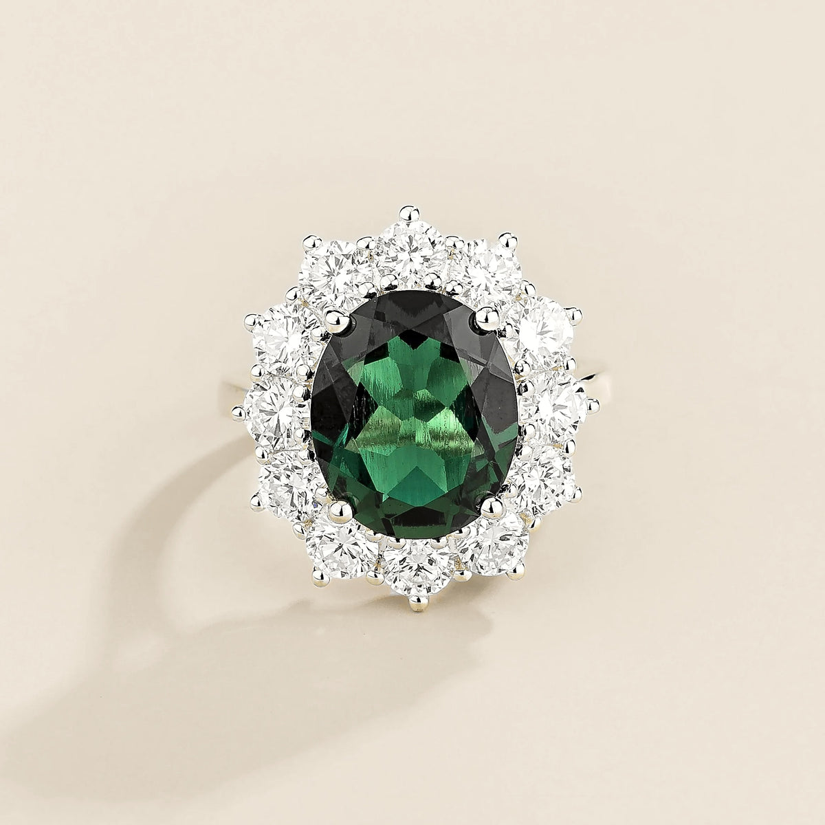 Oda oval emerald & diamond halo ring in white gold