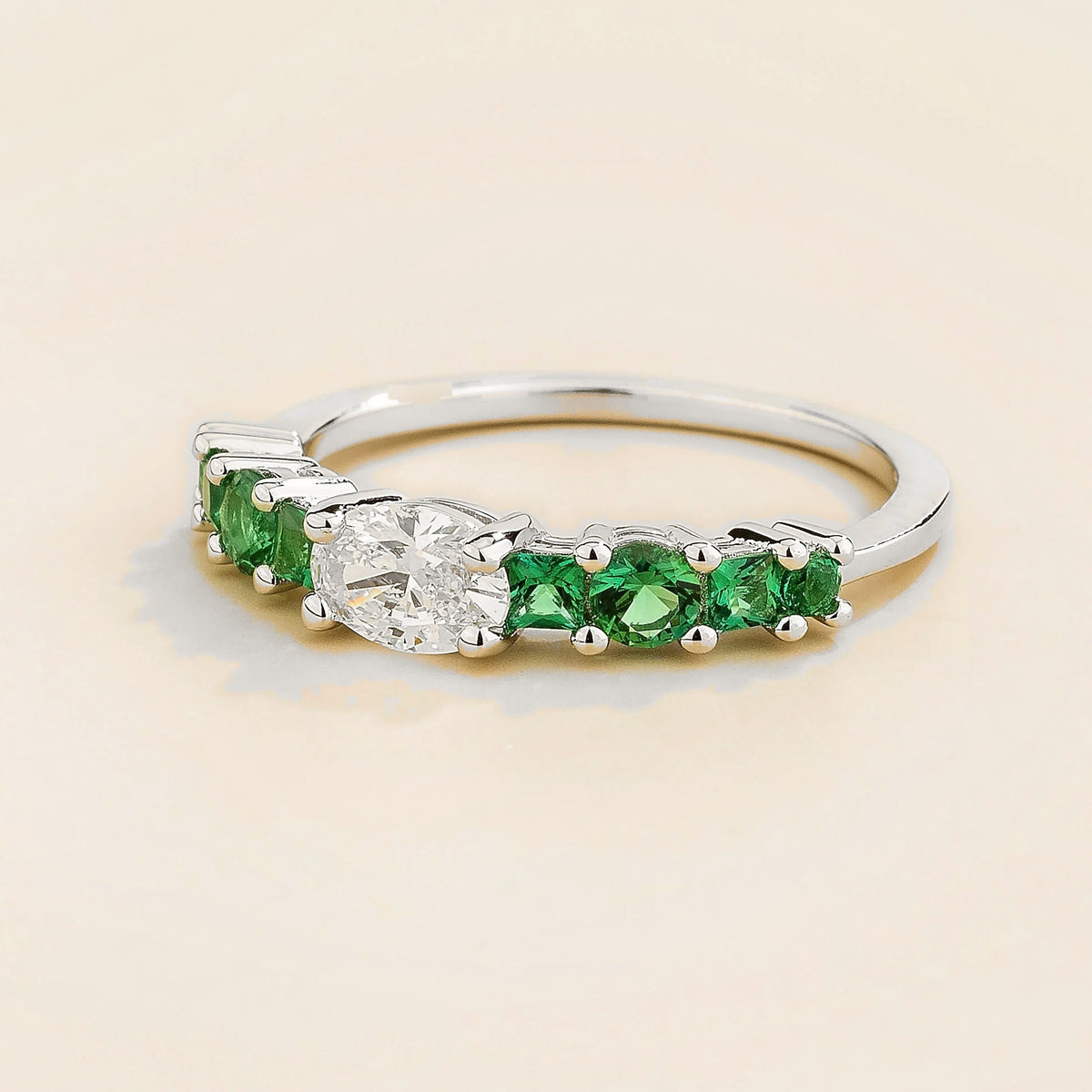 Petra Oval Diamond & Emerald Half Eternity Ring in White Gold – front view