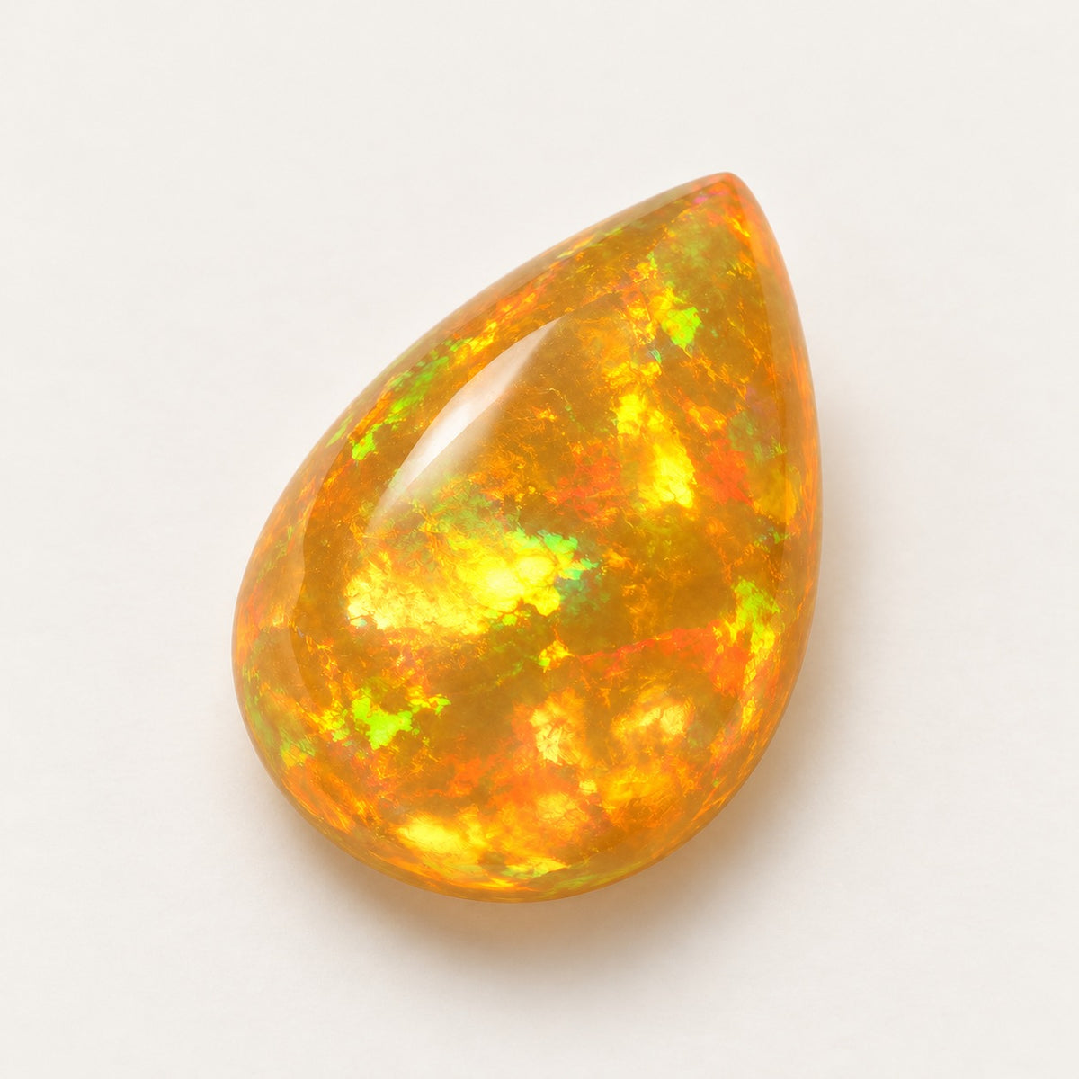 Fire lab-grown opal, pear cabochon, 45° view