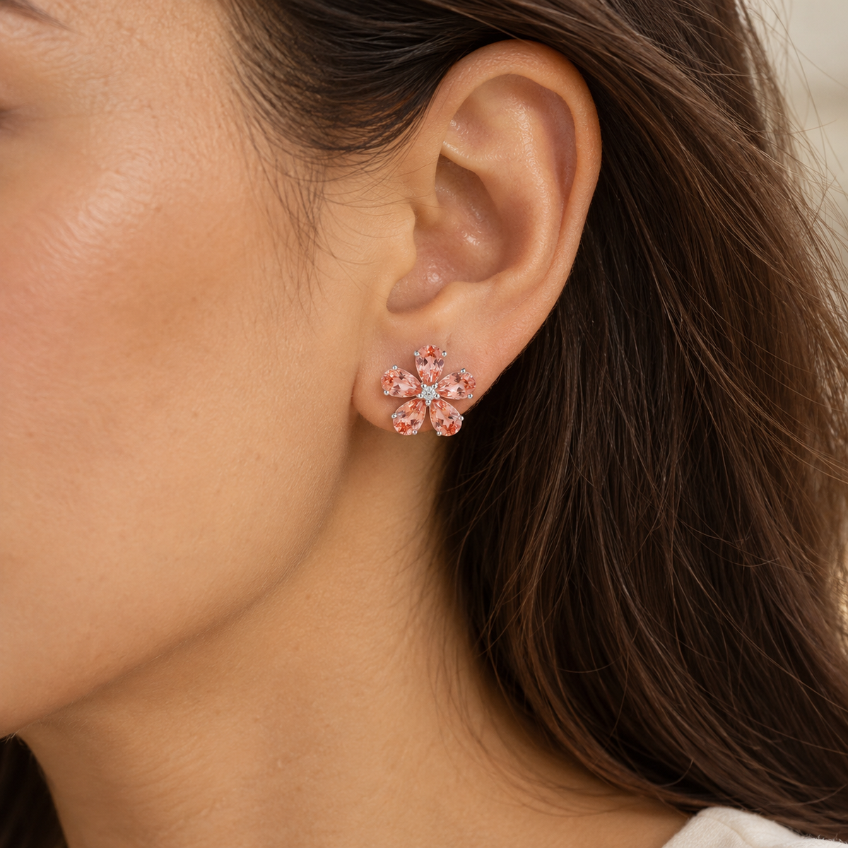Model wears the Florea Padparadscha Sapphire & Diamond Flower Stud Earrings in White Gold
