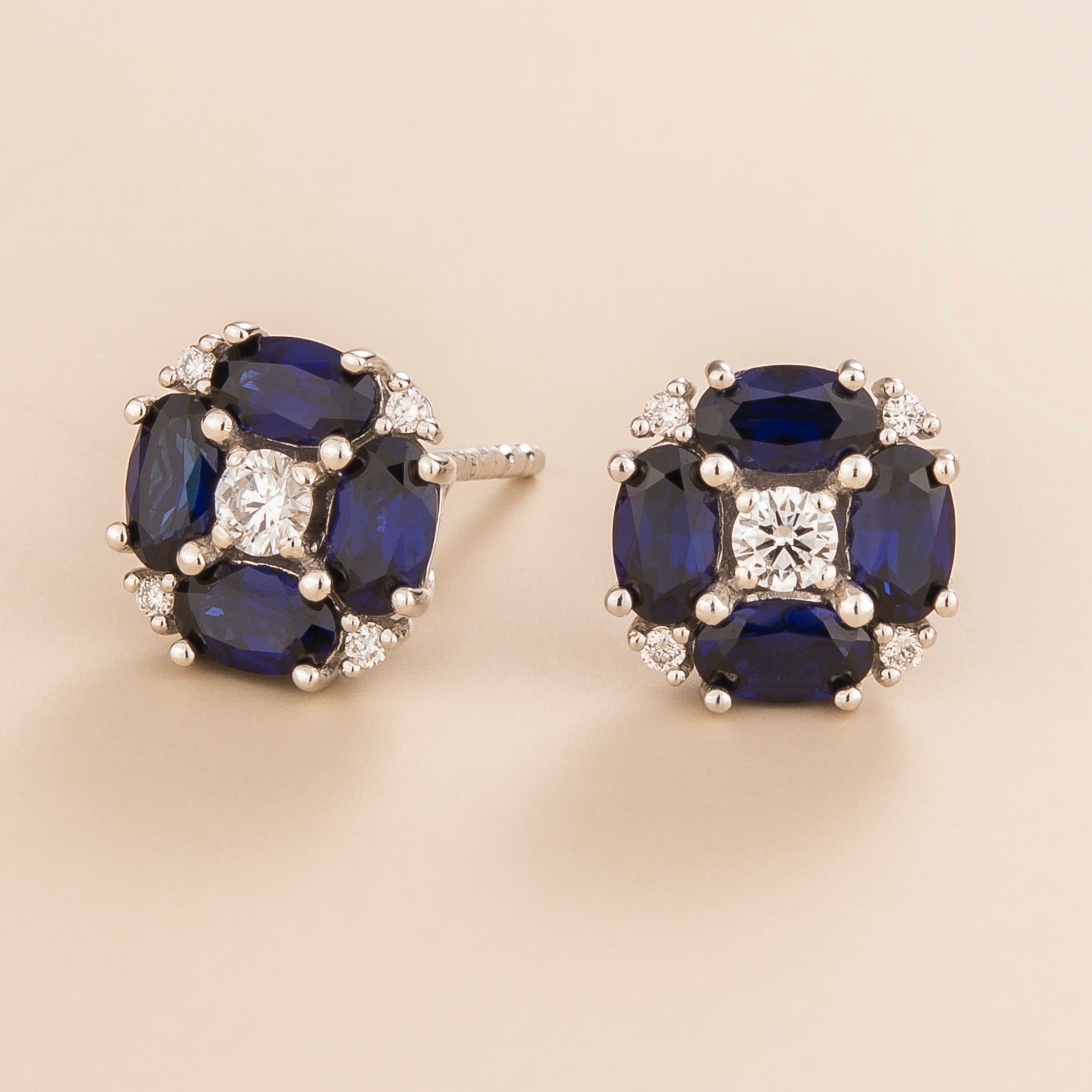 Pristi earrings in 18K white gold vermeil set with lab grown Diamond and oval Blue Sapphire gem stones.