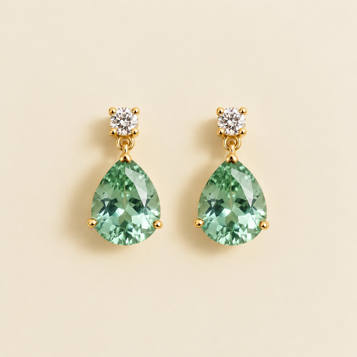 Medium lab-grown green sapphire and diamond pear drop earrings in gold – front view | Pisa by Juvetti