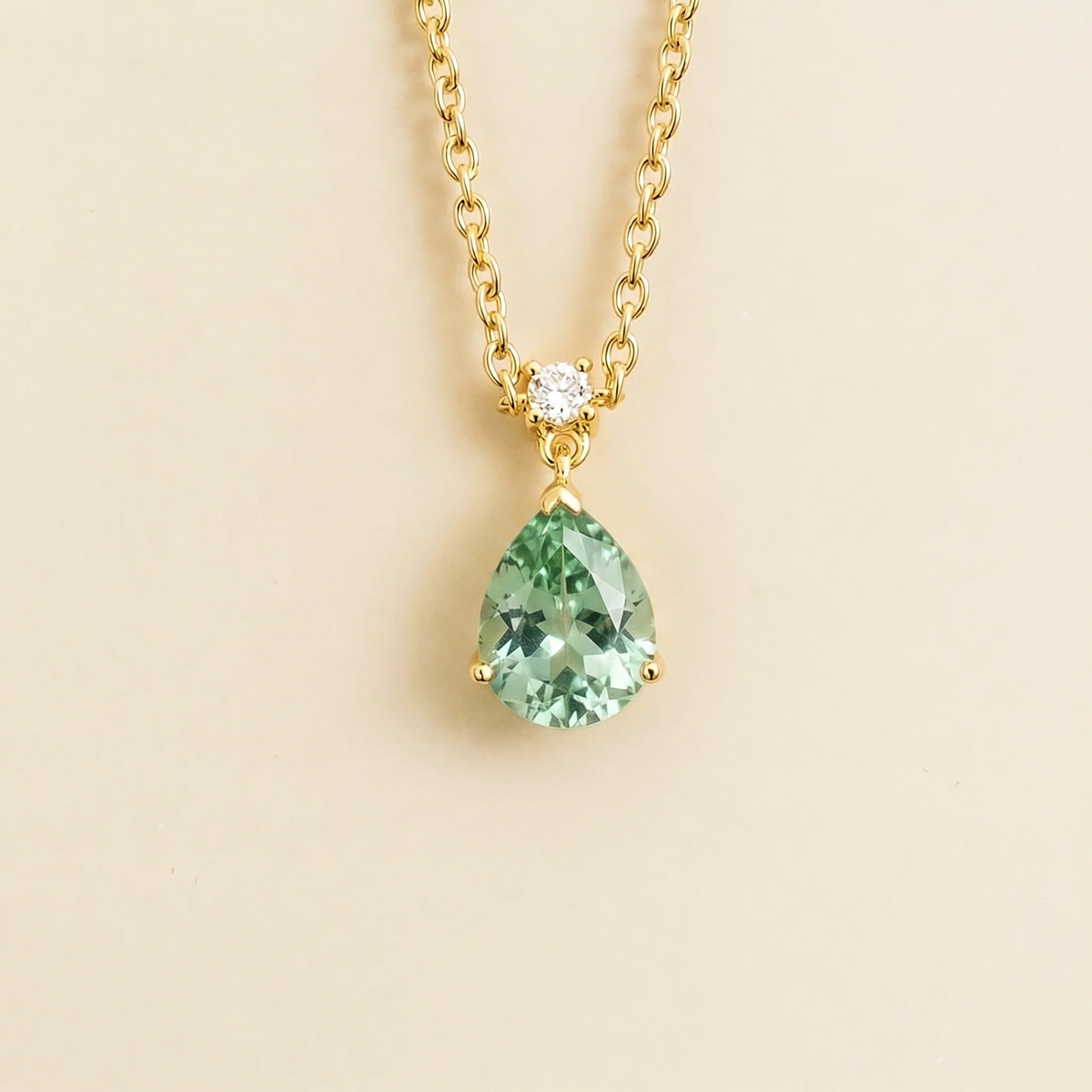 Lab-grown green sapphire and diamond pear drop pendant necklace in gold, medium – front view | Pisa by Juvetti