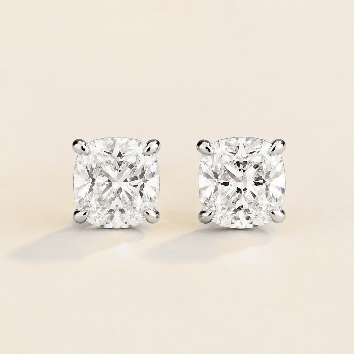 Iris cushion lab-grown diamond solitaire stud earrings in white gold – front view | Juvetti