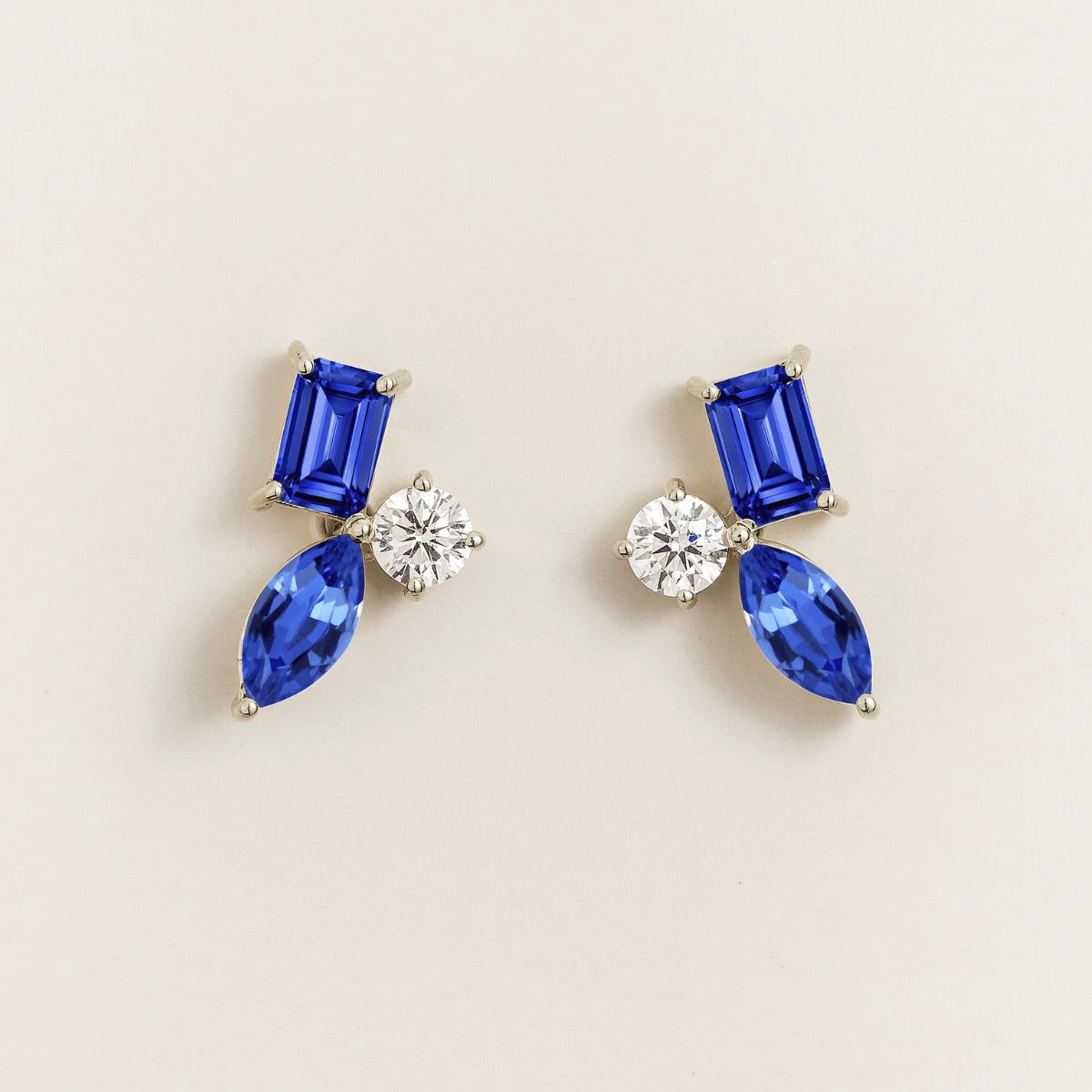 Sanka blue sapphire cluster stud earrings in white gold: baguette and marquise lab-grown sapphires, round diamond