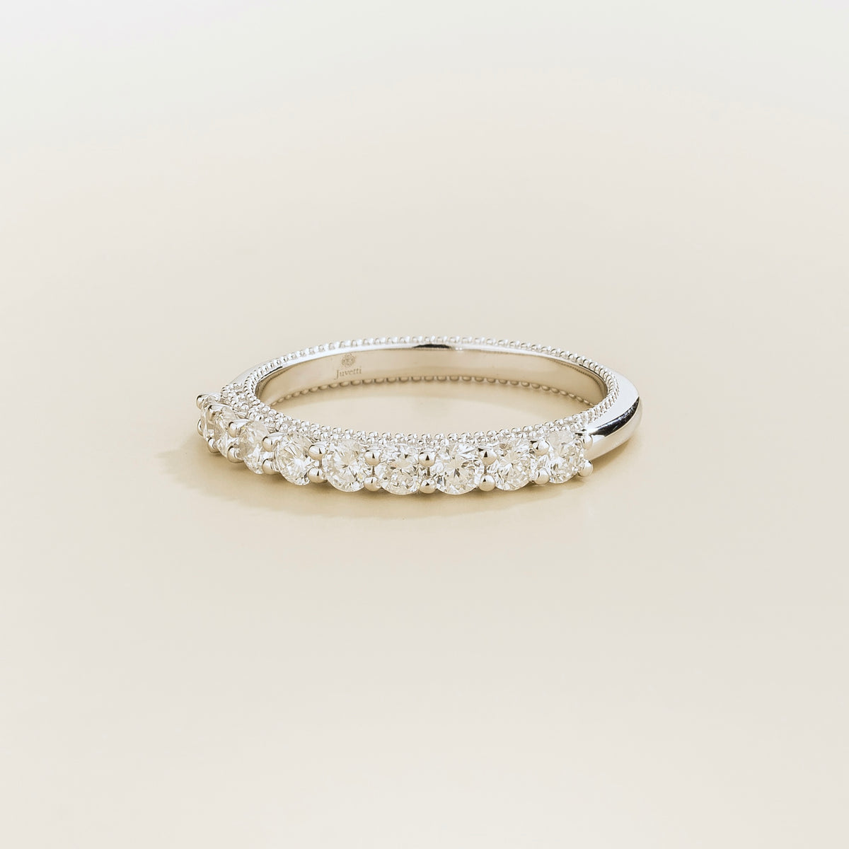 Tempo half eternity wedding band in white gold, round lab-grown diamonds with milgrain edges, angled view