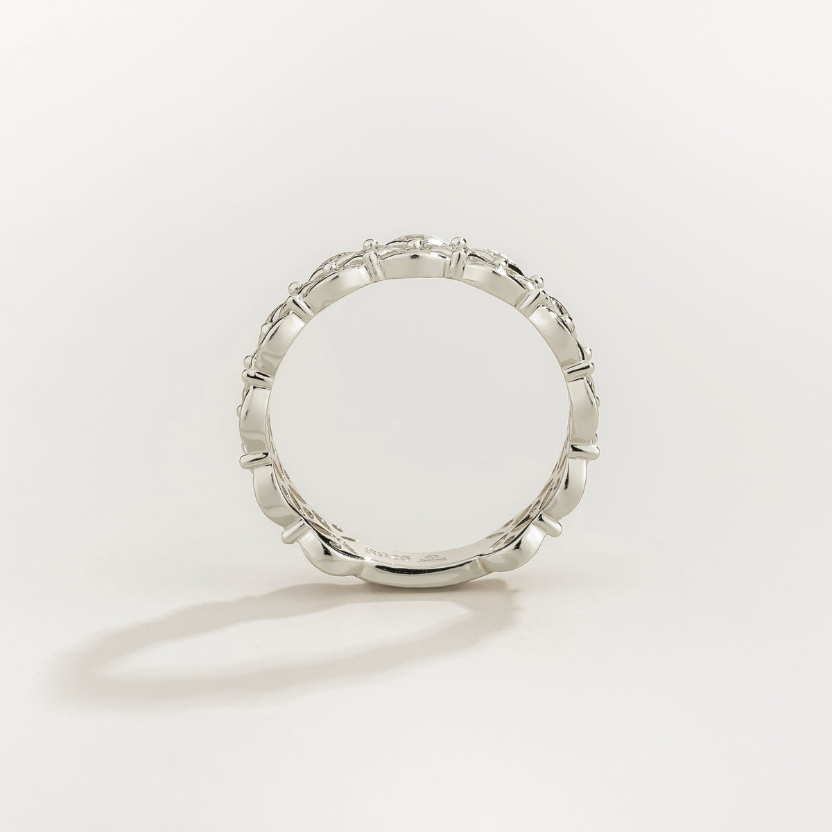 Padre openwork floral diamond eternity ring in white gold, lab-grown diamonds in each flower, on hand