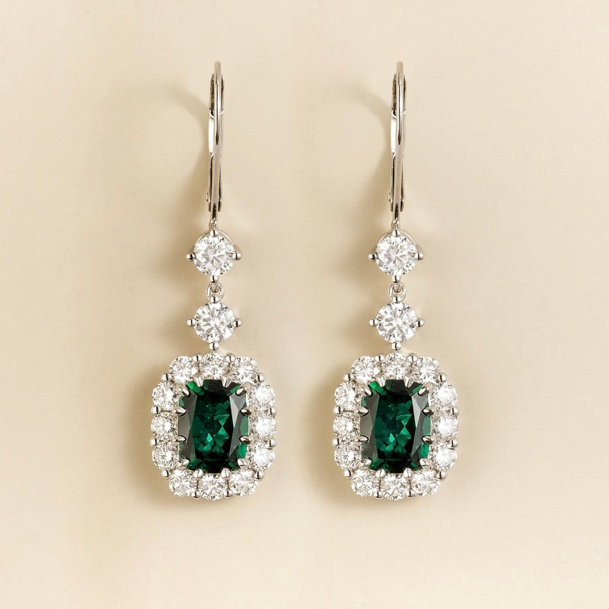 Pippa emerald-cut emerald and diamond halo drop earrings in white gold, lab-grown emeralds hanging from round diamonds on lever-back hooks