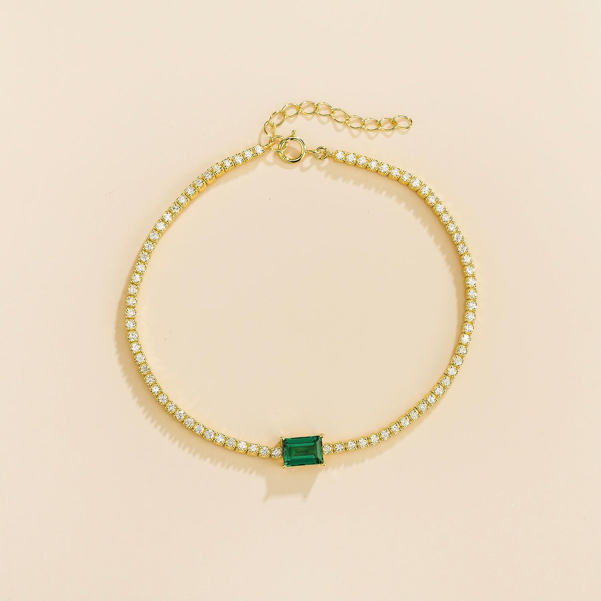 Mesa emerald-cut lab-grown emerald and diamond tennis bracelet in gold, side view