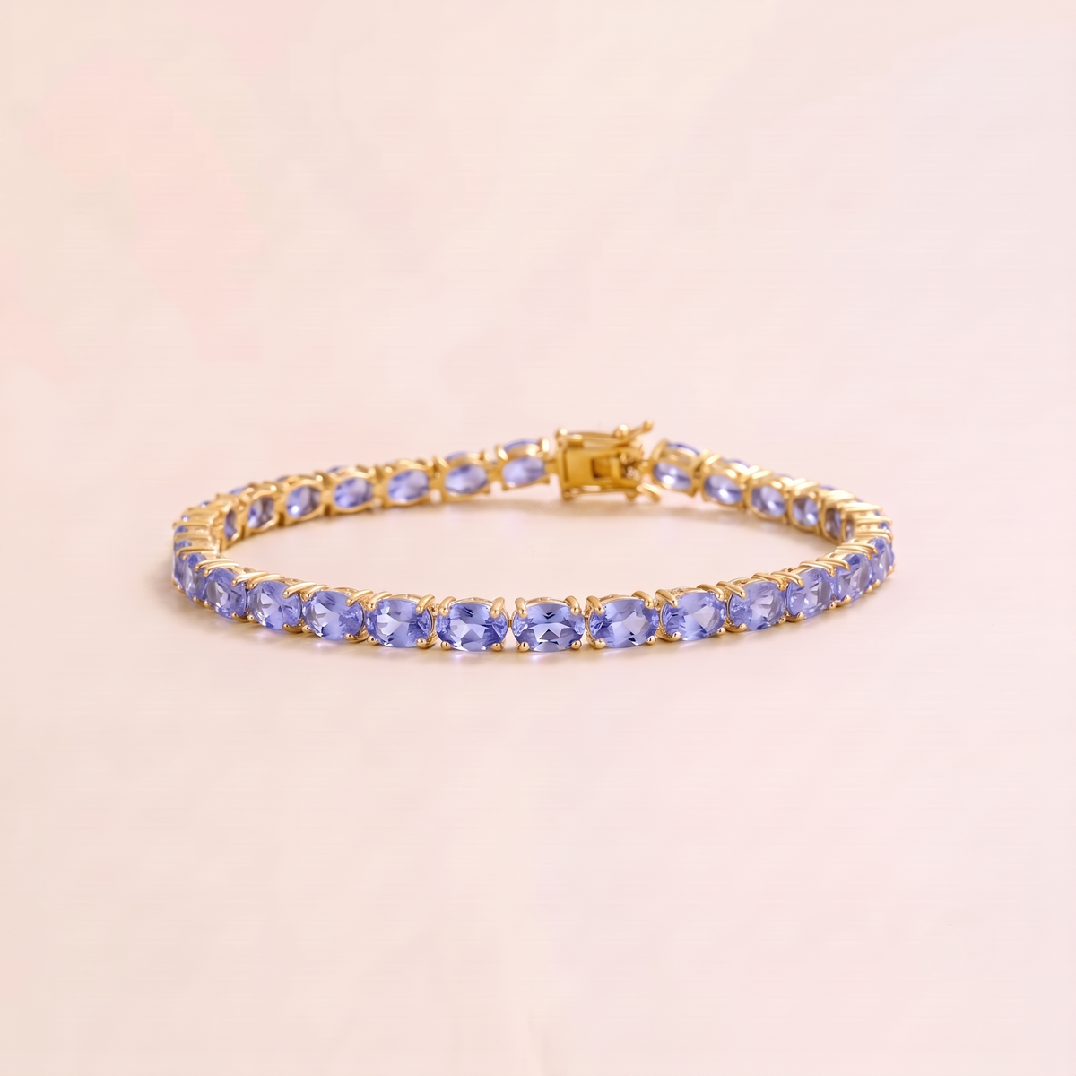Salto light blue sapphire oval tennis bracelet in gold