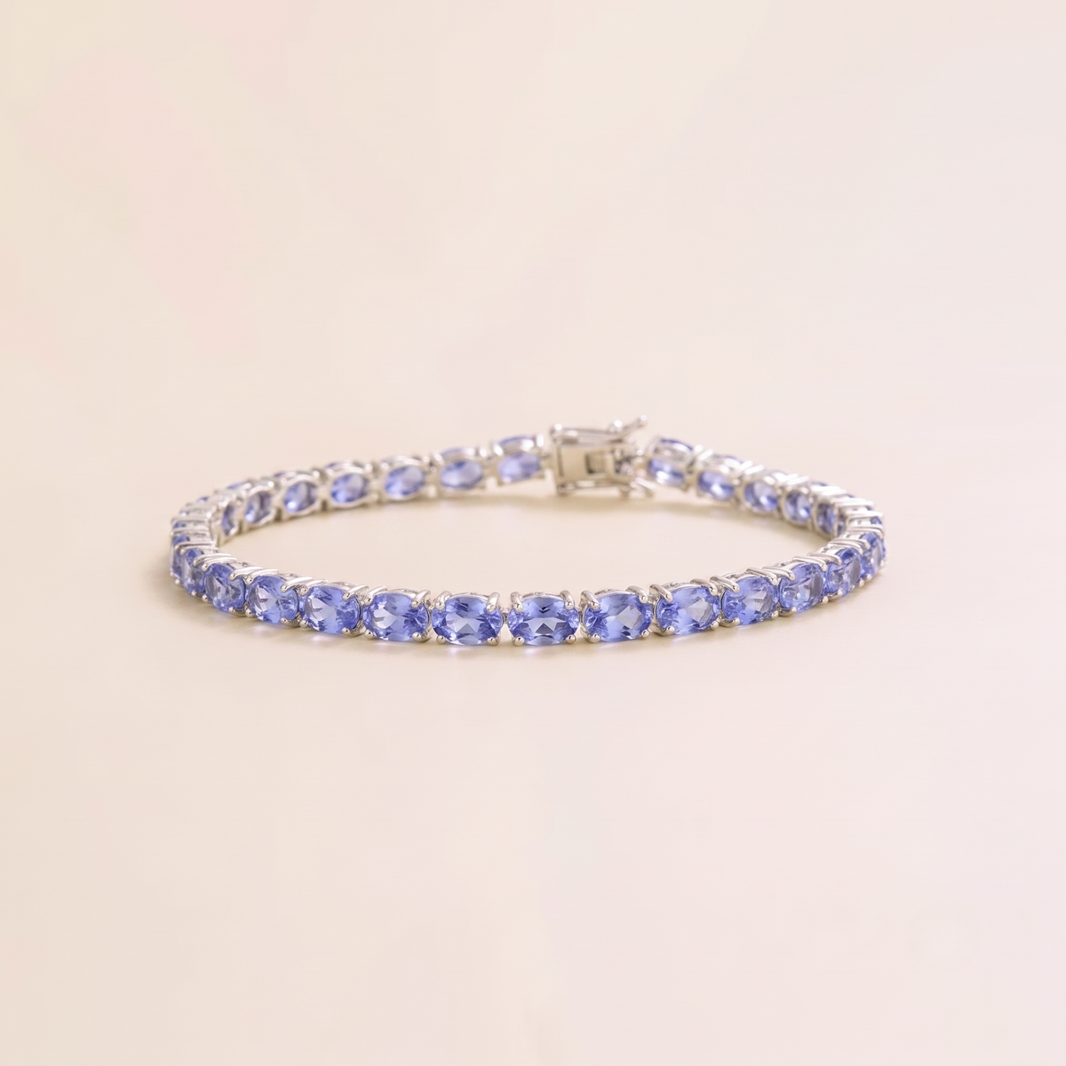 Salto light blue sapphire oval tennis bracelet in white gold