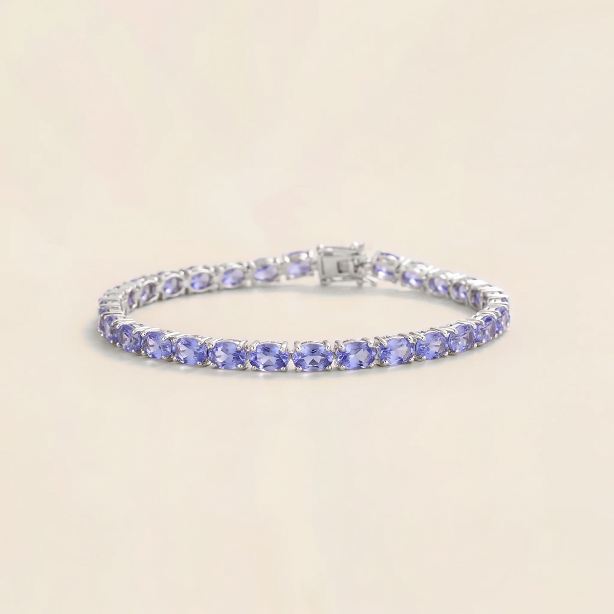 Salto light blue sapphire oval tennis bracelet in white gold