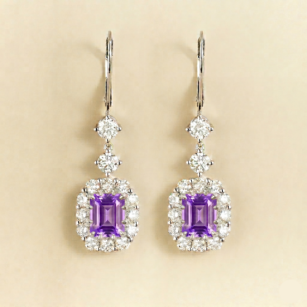 Pippa emerald-cut purple sapphire and diamond halo drop earrings in white gold, lab-grown sapphires hanging from round diamonds on lever-back hooks