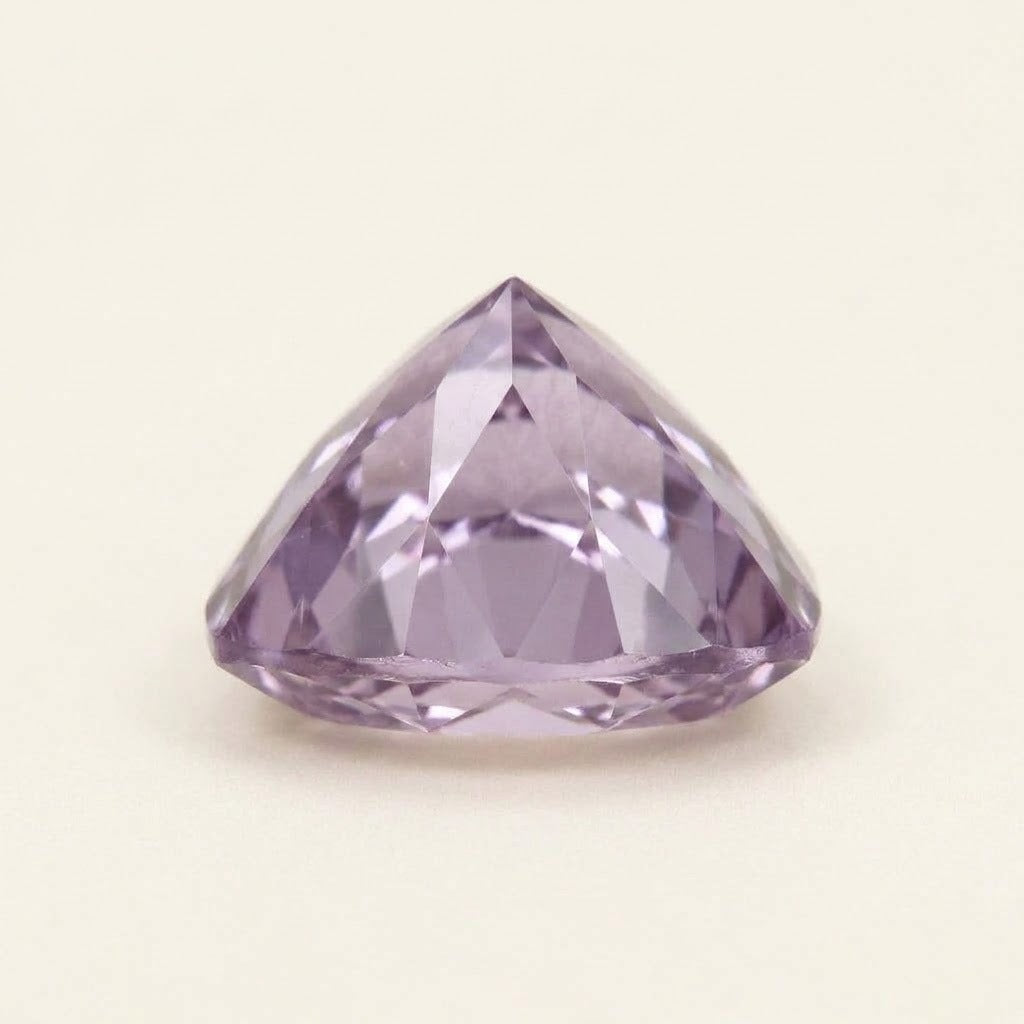 Lavender lab-grown sapphire, trillion cut, side view