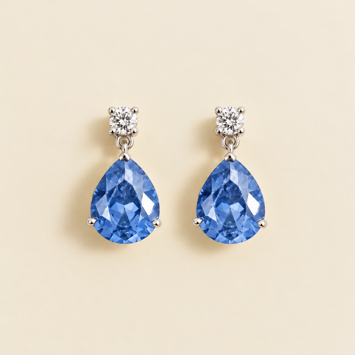 Medium lab-grown light blue sapphire and diamond pear drop earrings in white gold – front view | Pisa by Juvetti