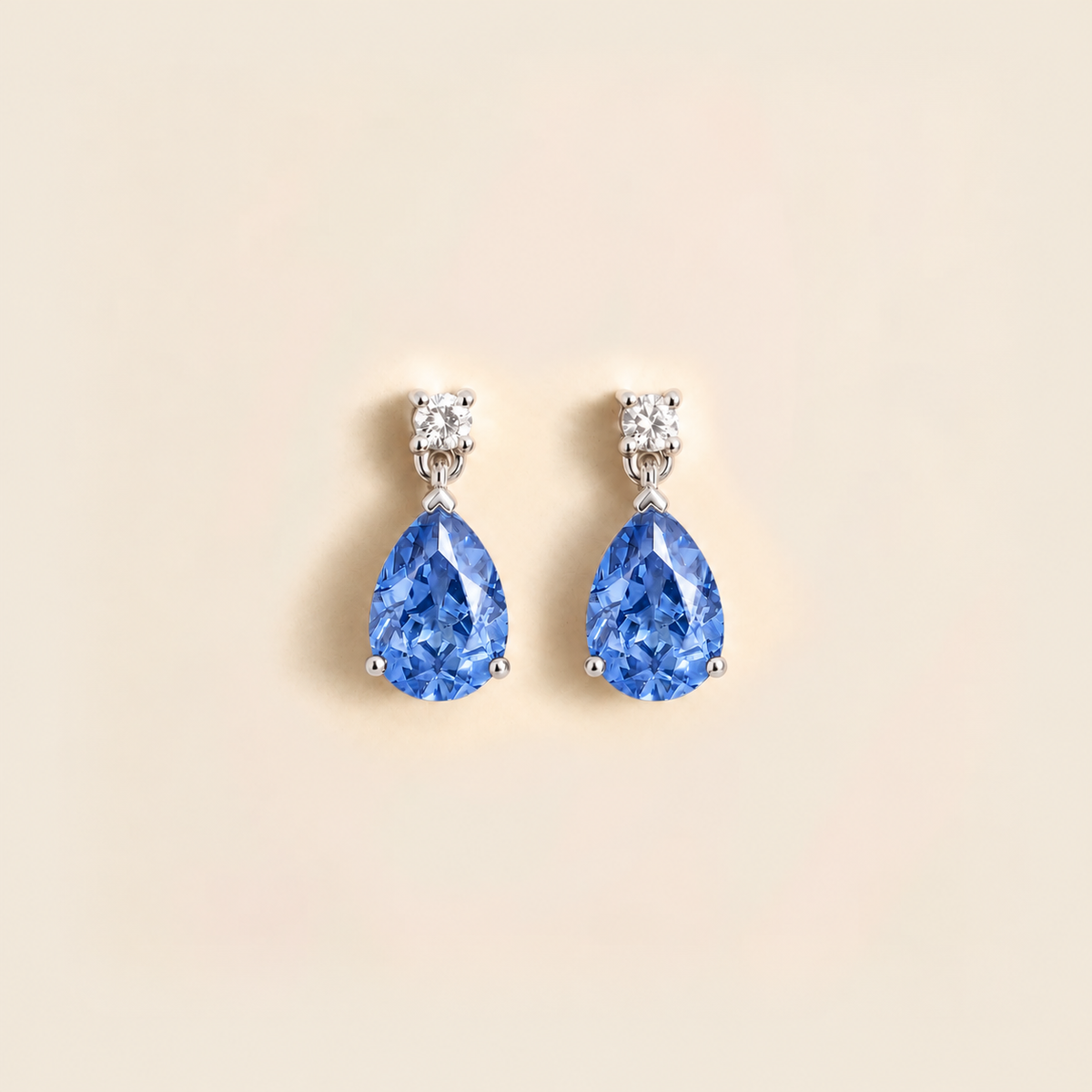 Pisa light blue sapphire and diamond pear drop earrings in white gold