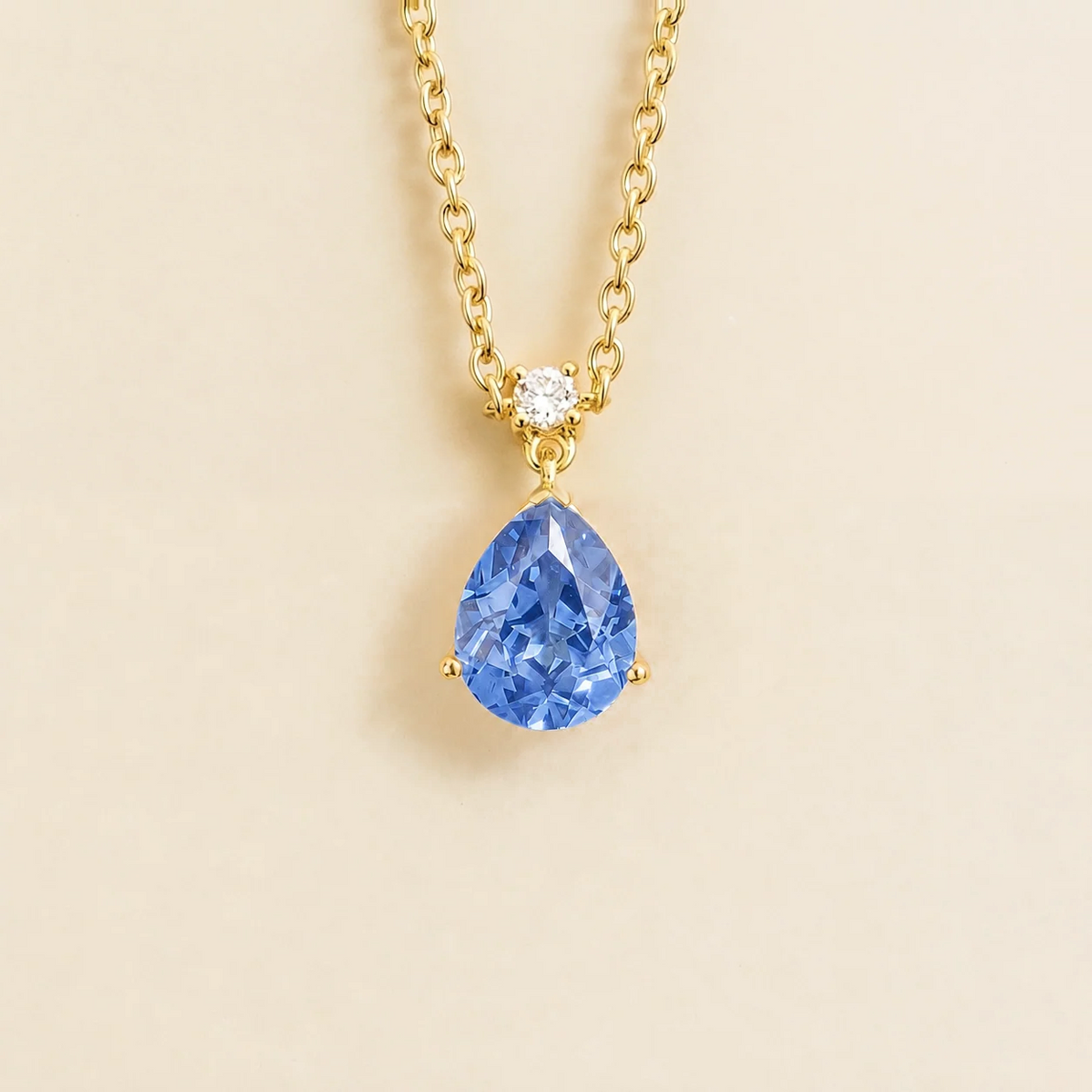 Lab-grown light blue sapphire and diamond pear drop pendant necklace in gold, medium – front view | Pisa by Juvetti
