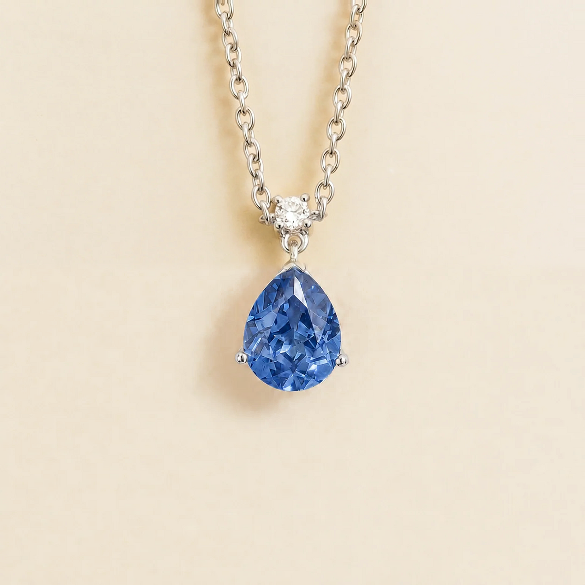 Lab-grown light blue sapphire and diamond pear drop pendant necklace in white gold, medium – front view | Pisa by Juvetti