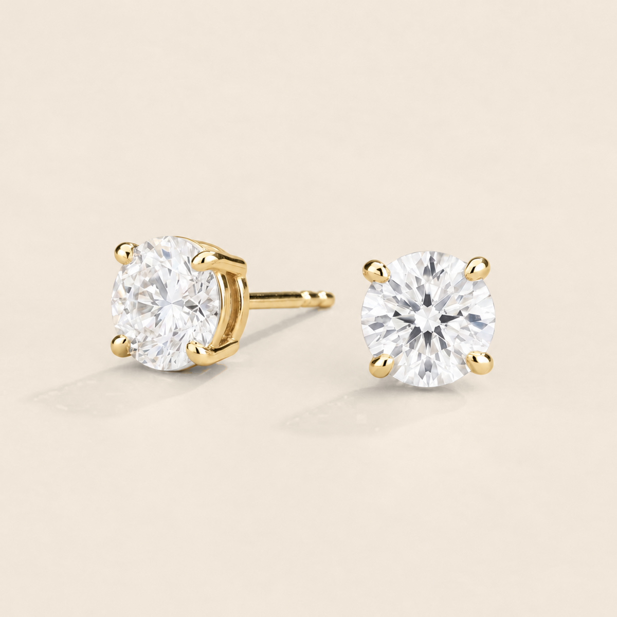 Nina round lab-grown diamond solitaire stud earrings in gold – angled view | Juvetti