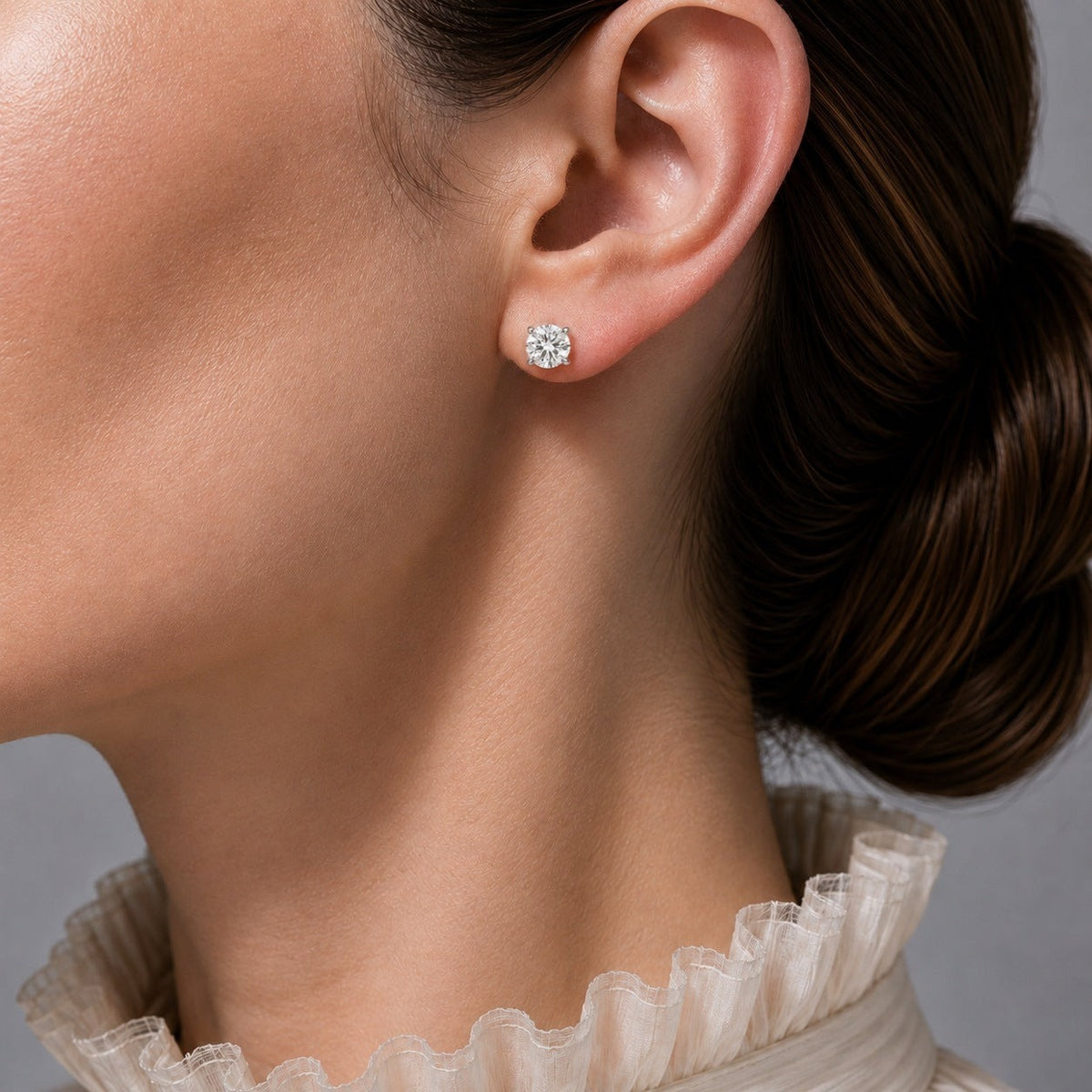 Nina round lab-grown diamond solitaire stud earrings in white gold – on model | Juvetti