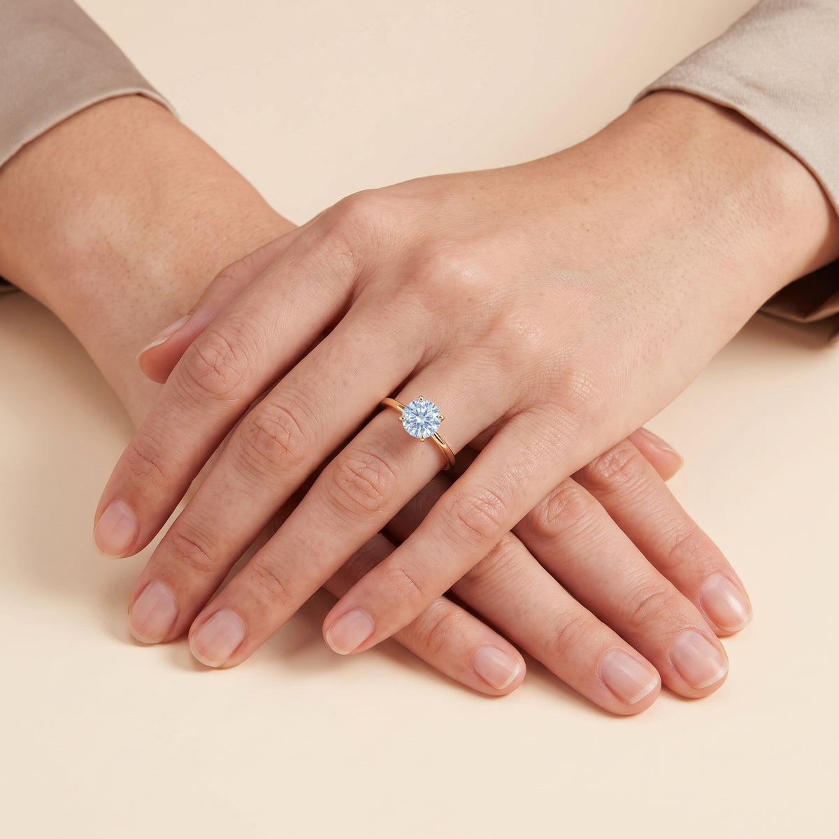 Model wearing the Nina Round Shape Aquamarine Cathedral Solitaire Ring in Gold