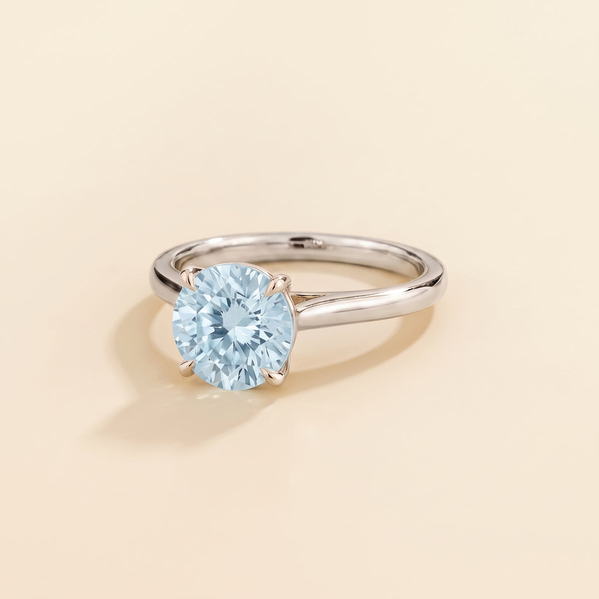 Nina Round Shape Aquamarine Cathedral Solitaire Ring in White Gold, three-quarter view