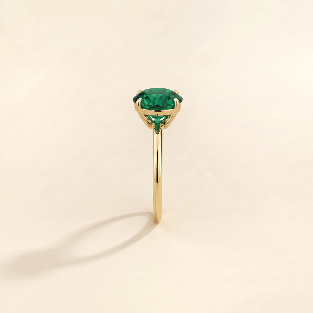 Nina Round Shape Emerald Cathedral Solitaire Ring in Gold, side edge view
