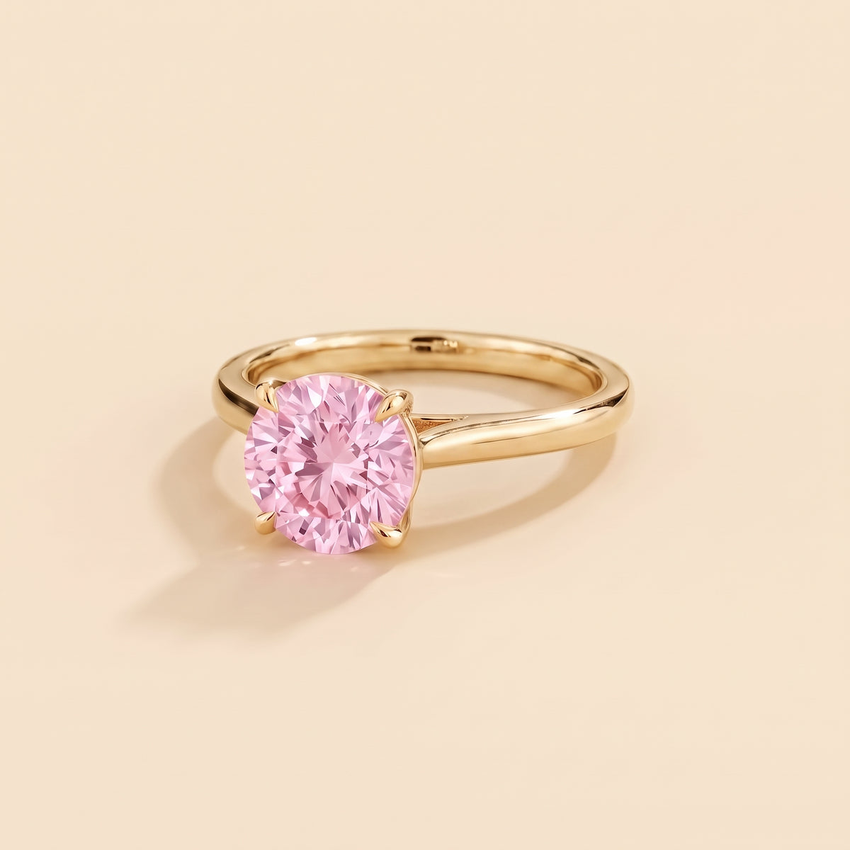 Nina Round Shape Pastel Pink Sapphire Cathedral Solitaire Ring in Gold, three-quarter view