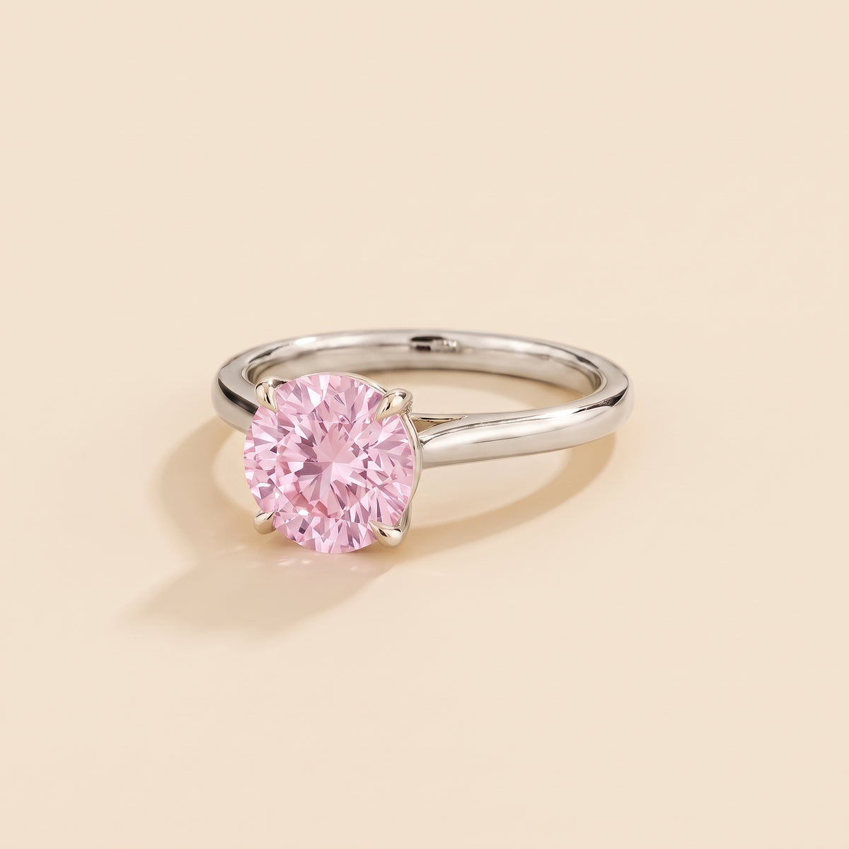 Nina Round Shape Pastel Pink Sapphire Cathedral Solitaire Ring in White Gold, three-quarter view