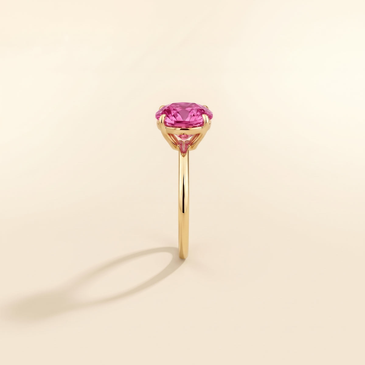 Nina Round Shape Vivid Pink Sapphire Cathedral Solitaire Ring in Gold, side edge view