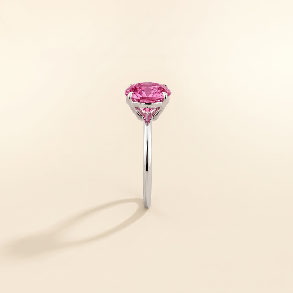 Nina Round Shape Vivid Pink Sapphire Cathedral Solitaire Ring in White Gold, side edge view