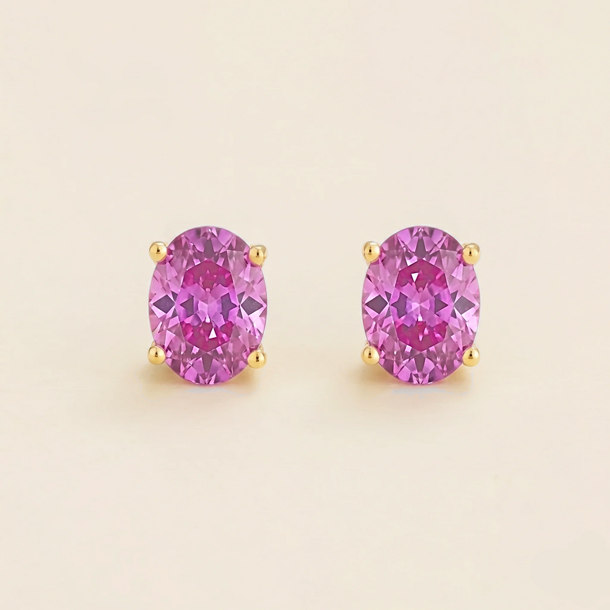 Ovo Vivid Pink Sapphire Oval Stud Earrings in Gold | Juvetti