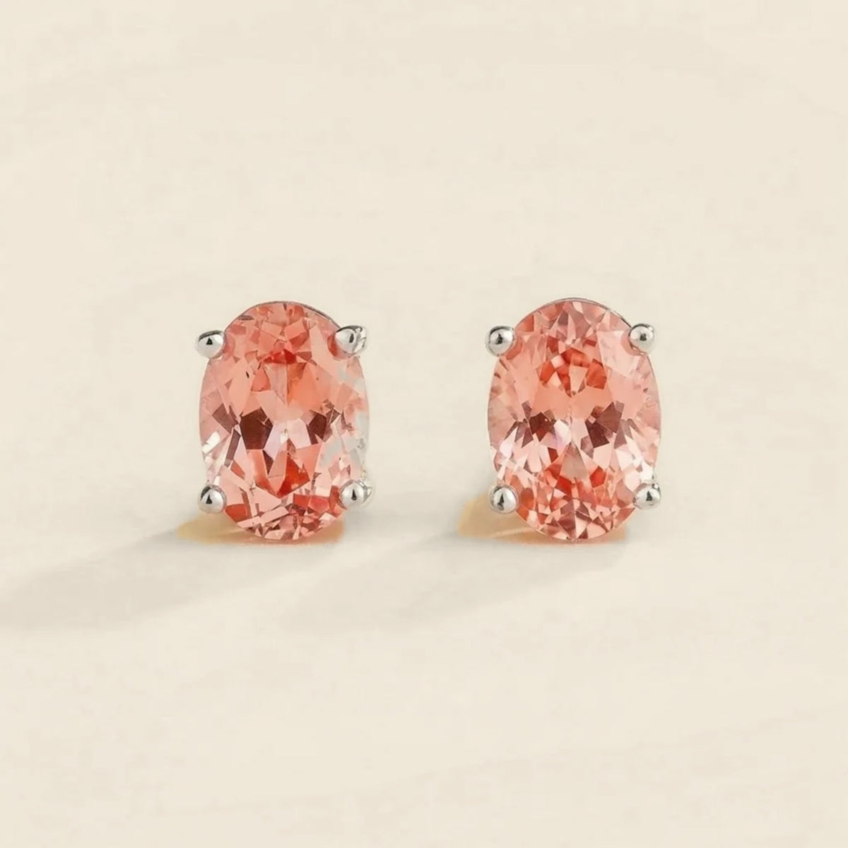 Ovo padparadscha sapphire oval solitaire stud earrings in white gold