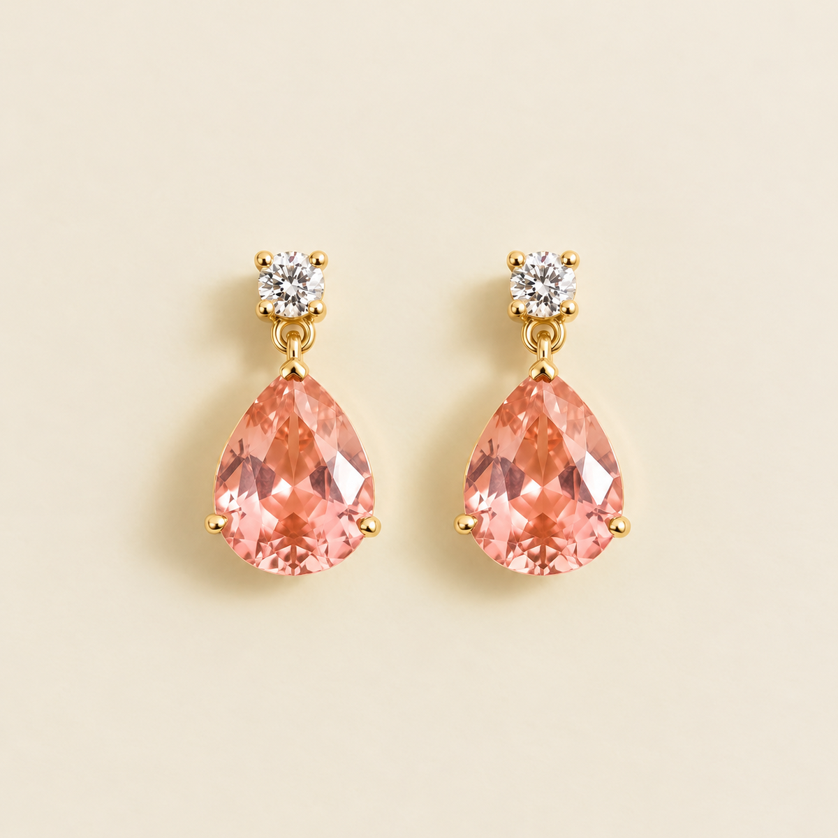 Medium lab-grown Padparadscha sapphire and diamond pear drop earrings in gold – front view | Pisa by Juvetti