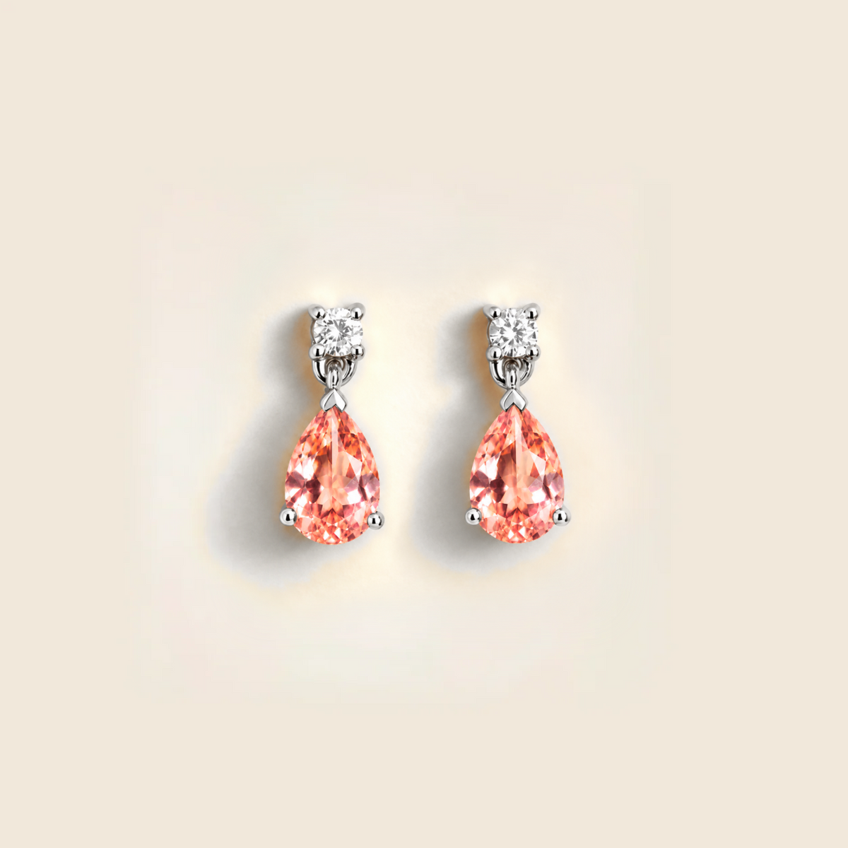 Lab-grown padparadscha sapphire and diamond pear drop earrings in white gold – front view | Pisa by Juvetti
