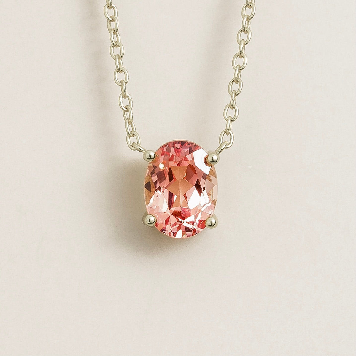 Padparadscha sapphire solitaire pendant necklace in white gold