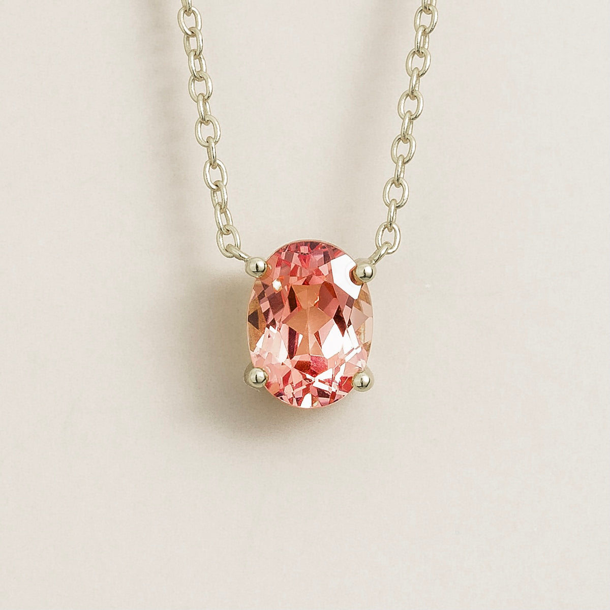 Padparadscha sapphire solitaire pendant necklace in white gold