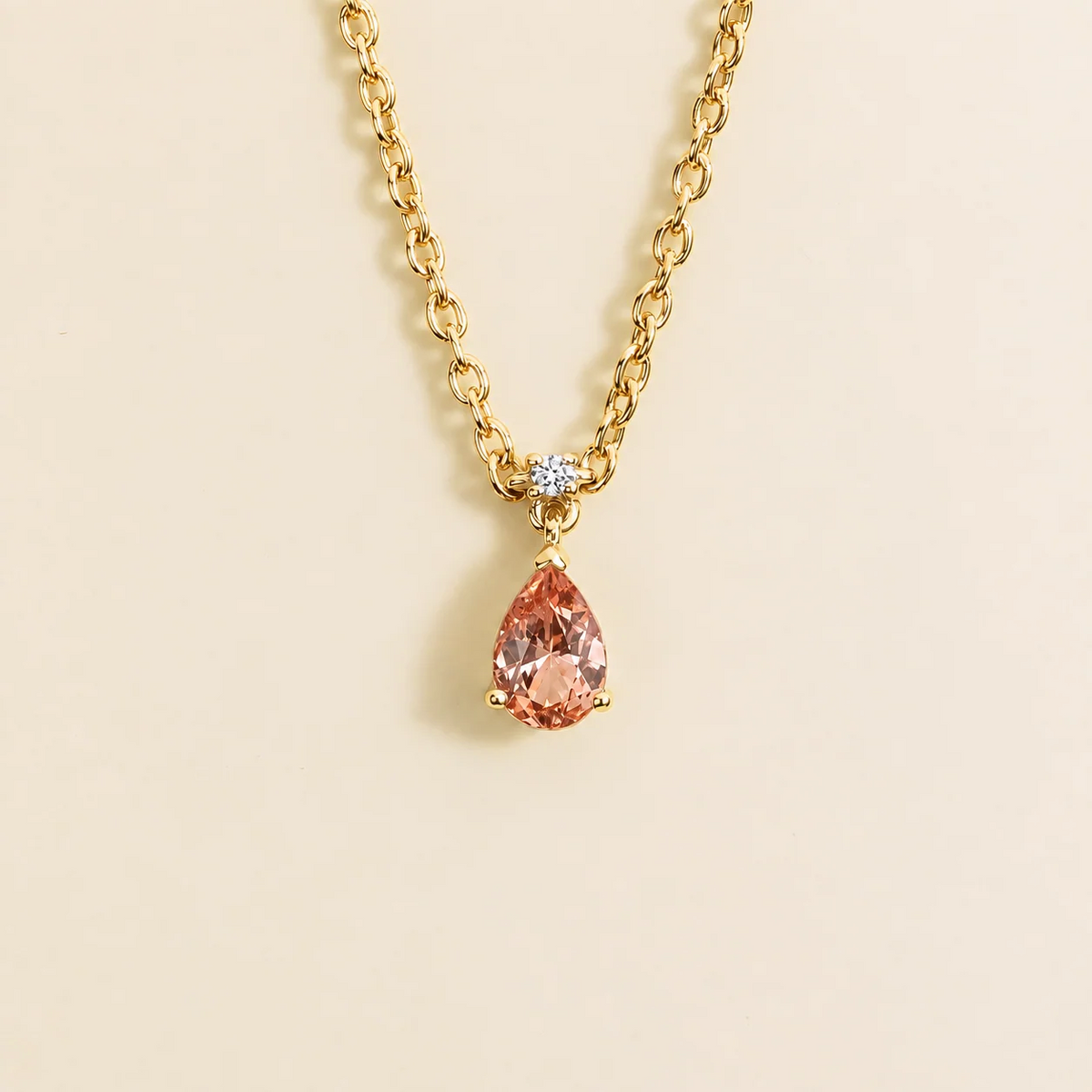 Lab-grown padparadscha sapphire and diamond pear drop pendant necklace in gold, small – front view | Pisa by Juvetti