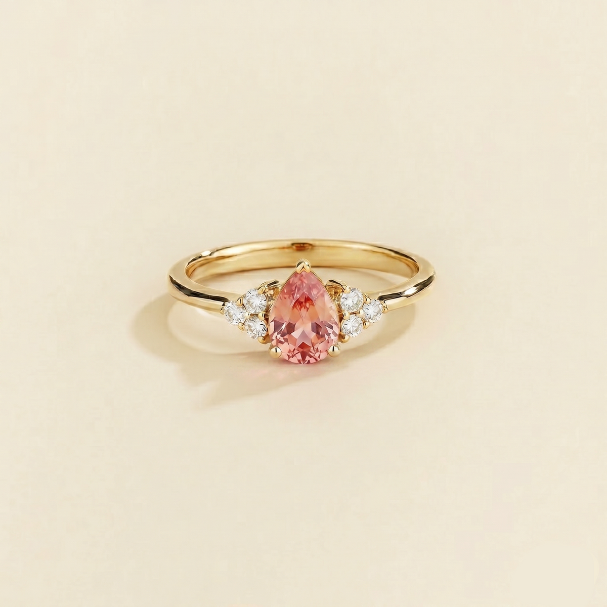 Pear-cut lab-grown padparadscha sapphire and diamond ring in gold – front view | Pisa by Juvetti