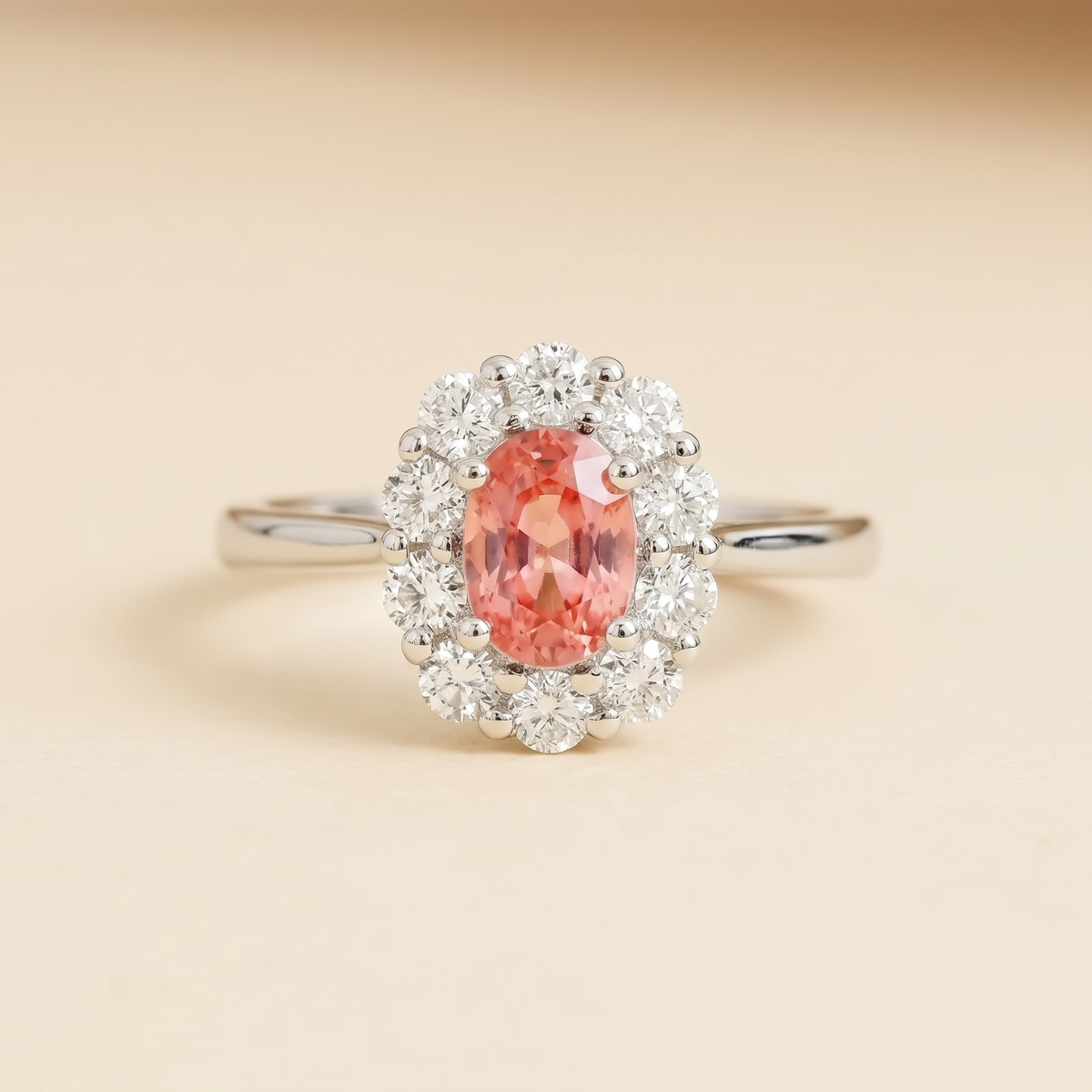 Lab-grown padparadscha sapphire and diamond oval halo ring in white gold – front view | Prill by Juvetti
