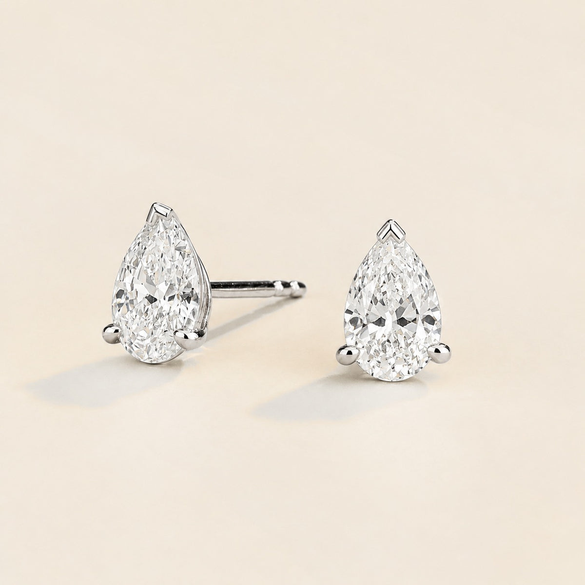 Pandal pear lab-grown diamond solitaire stud earrings in white gold – angled view | Juvetti